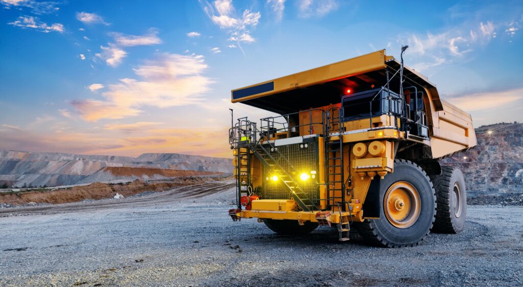 Haul,Truck,Parked,At,Quarry,During,Sunrise,In,Open,Pit.